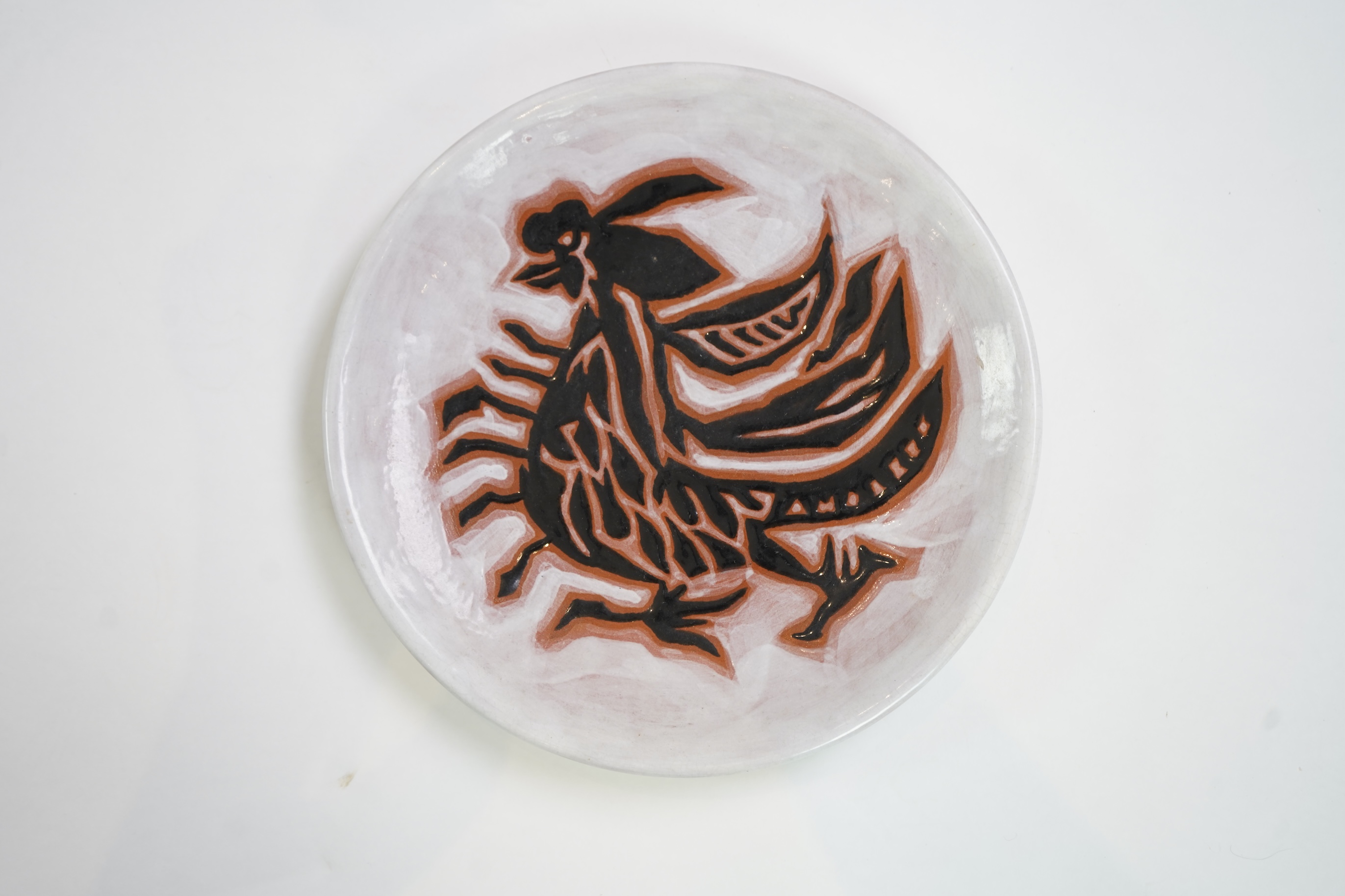 Jean Lurçat (1892-1966): A white glazed earthenware plate, decorated with a central stylised cockerel